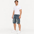Three-quarter angle of a model standing in Fleecora men's mid-waist regular-fit blue cargo denim shorts