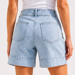 Back view of women’s light wash denim shorts with patch pockets